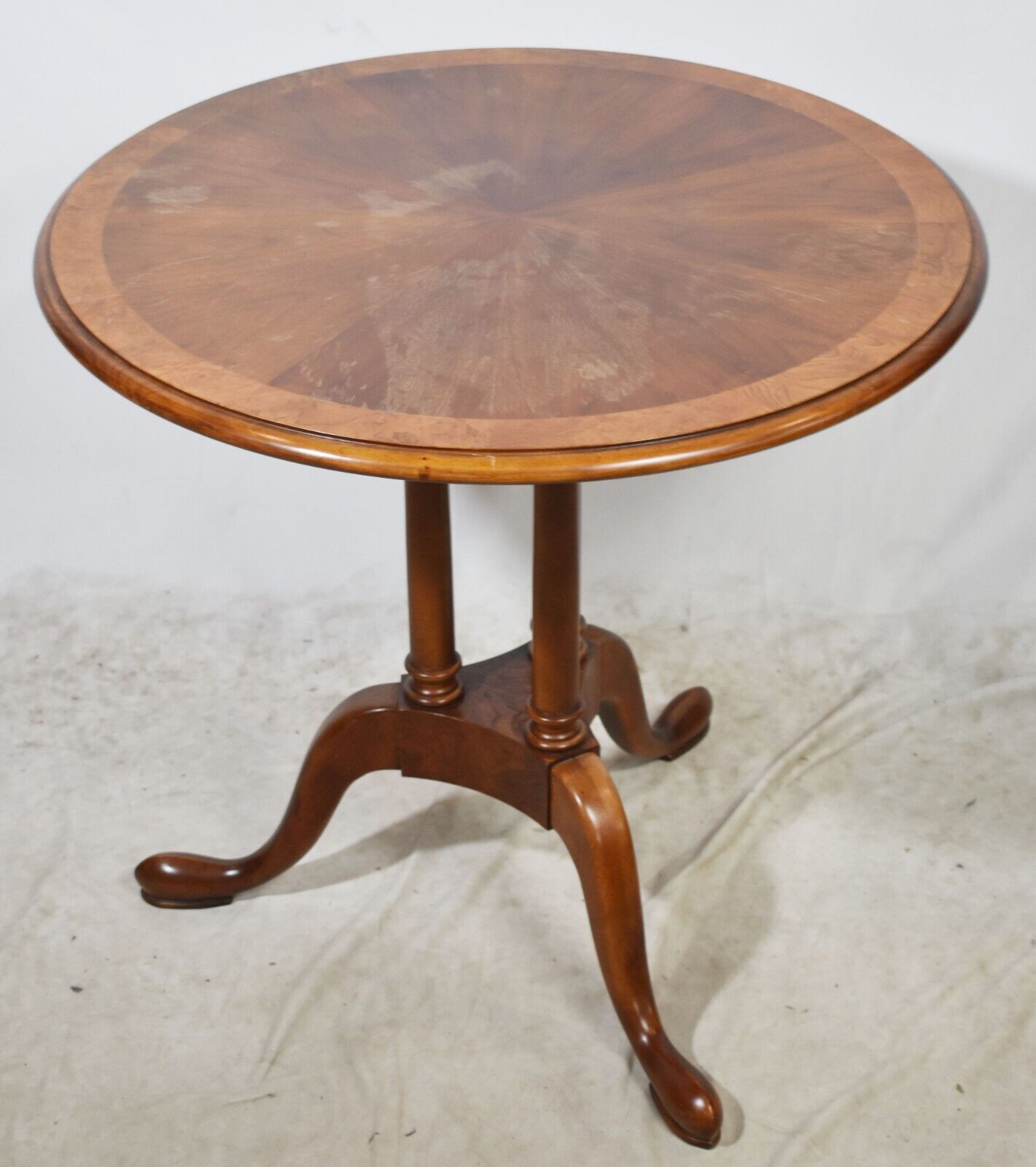 Baker Mahogany Banded Oval Three Column Base Occasional Table